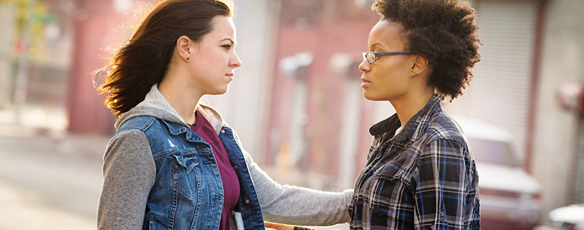 A woman consoling another woman